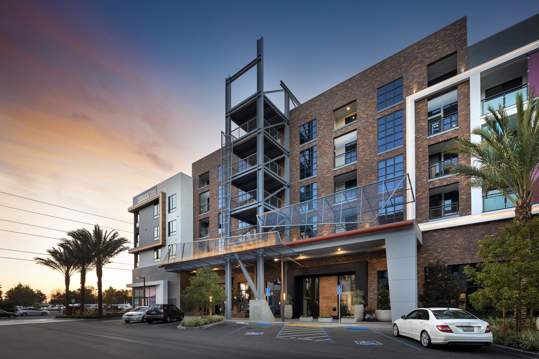 modern industrial building exterior at dusk broadstone archive apartments